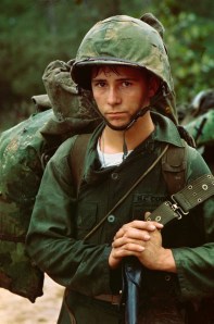 A young U.S. Marine waits on the beaches of Da Nang, Vietnam.