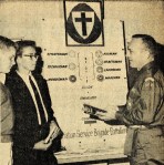 A Brigade leader explains different organizational ranks to young men (April 13, 1964 Standard) - Bethel University Digital Library