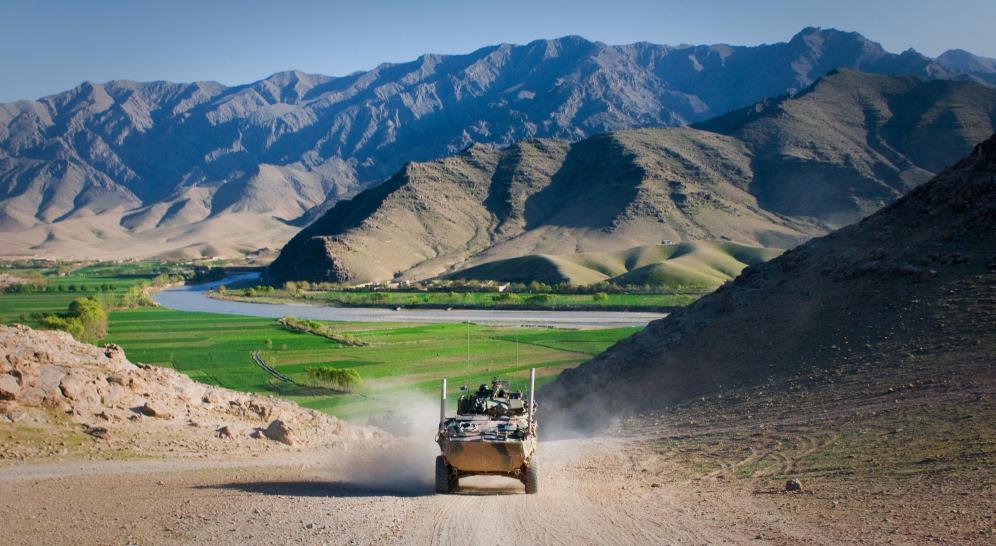 An Australian service light armored vehicle drives through Tangi Valley, Afghanistan, March 29. The terrain of Tangi Valley is notoriously rough, but the ASLAV maneuvers across it with ease, said Australian army Lt. McLeod Wood, a troop leader for 2nd Cavalry Regiment, Mentoring Task Force 2, Combined Team Uruzgan.